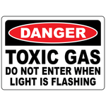 Danger toxic gas do not enter sign warning personnel when flashing light indicates hazardous conditions
