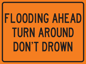 Flooding ahead turn around don’t drown warning sign for flooded roadway safety