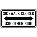 Sidewalk closed use other side double arrow sign guiding pedestrian traffic safely